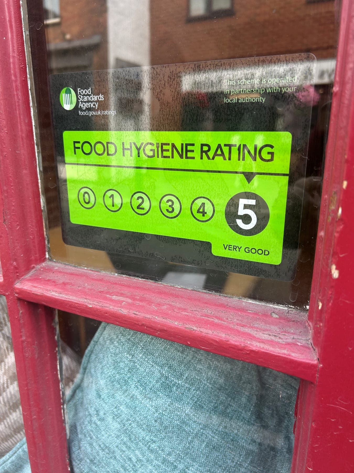Food Standards Agency food hygiene rating certificate showing a score of 5, Very Good, displayed in the café window